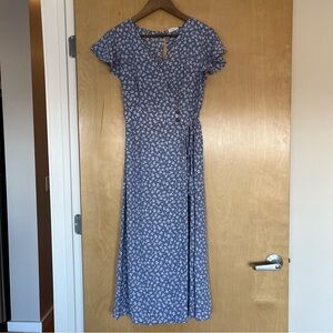 Blue midi dress with white floral pattern and ruffle sleeves